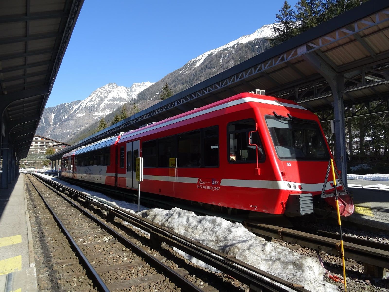 Mont Blanc Express train at Chamonix station beneath snowy mountains